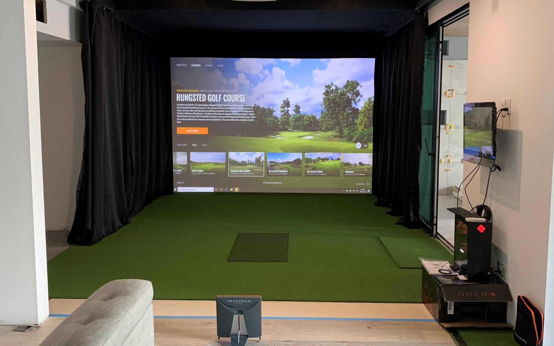 Home golf simulator projector with Trackman launch monitor