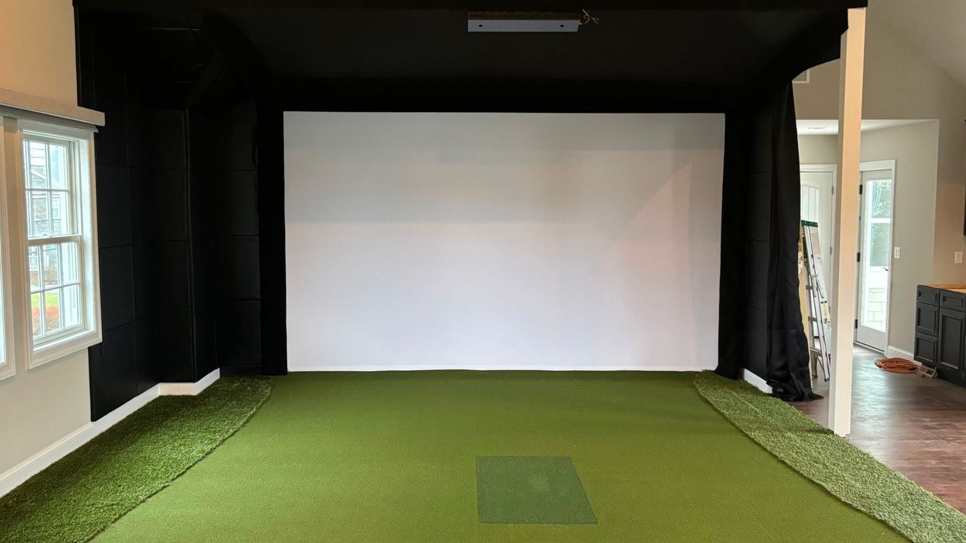 residential install room after installation with full golf simulator