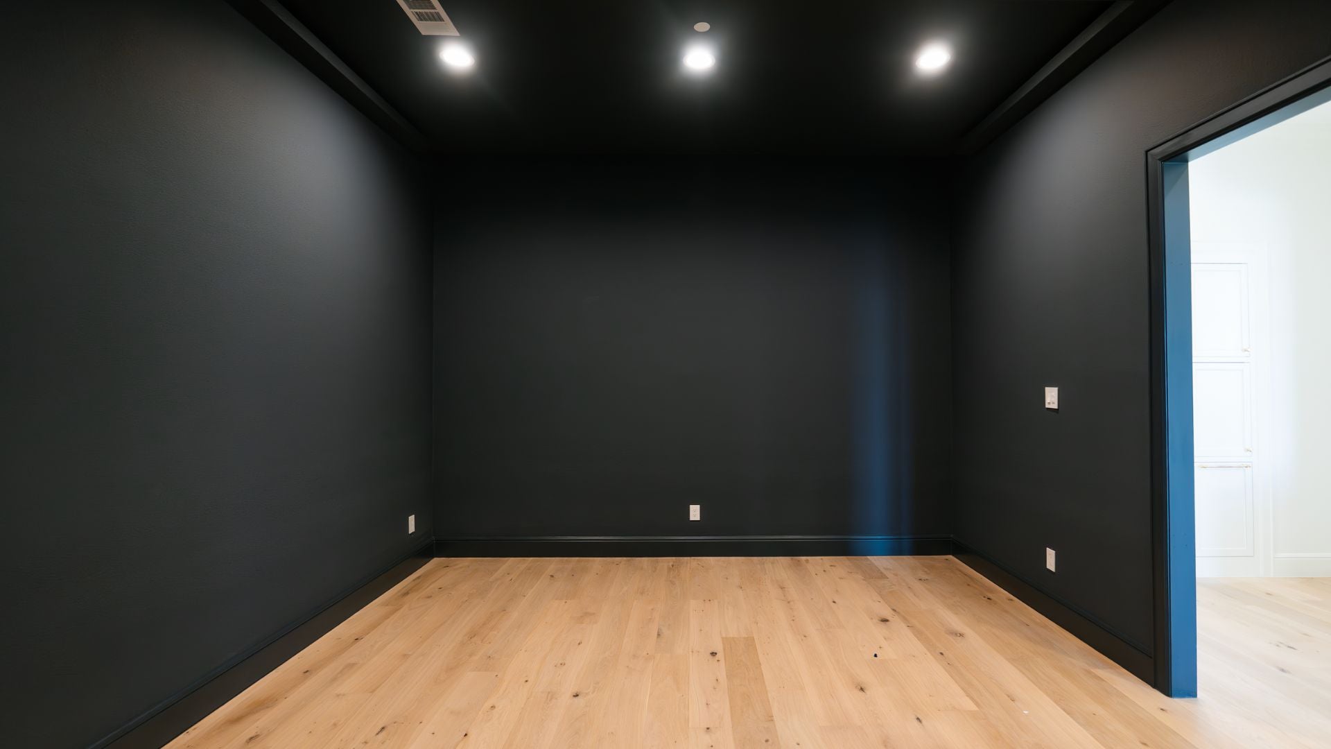 before image of a golf simulator room