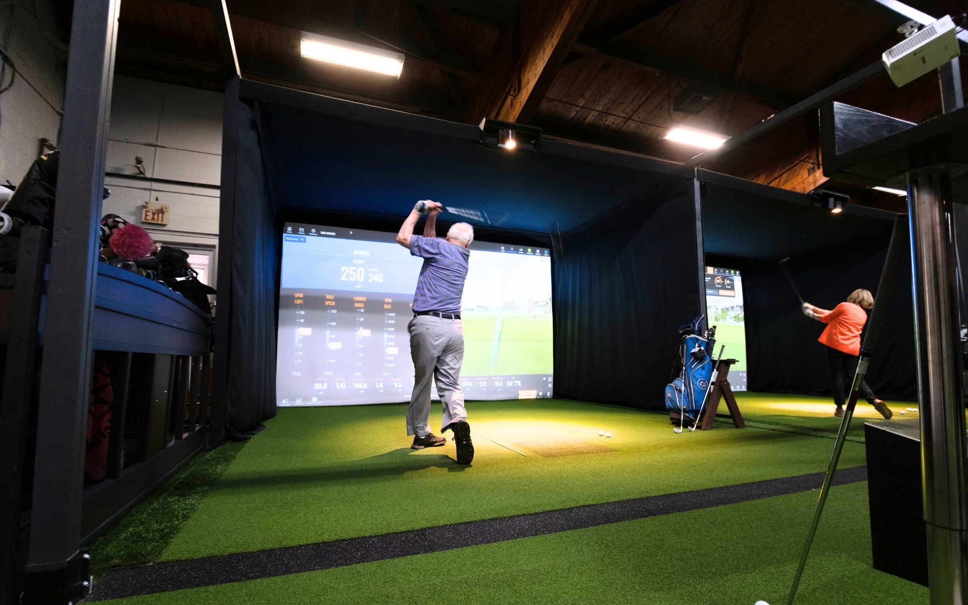 Indoor Golf Facility with multiple bays.