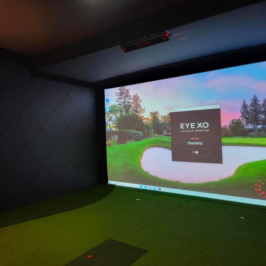 Residential golf simulator with diamond wall padding